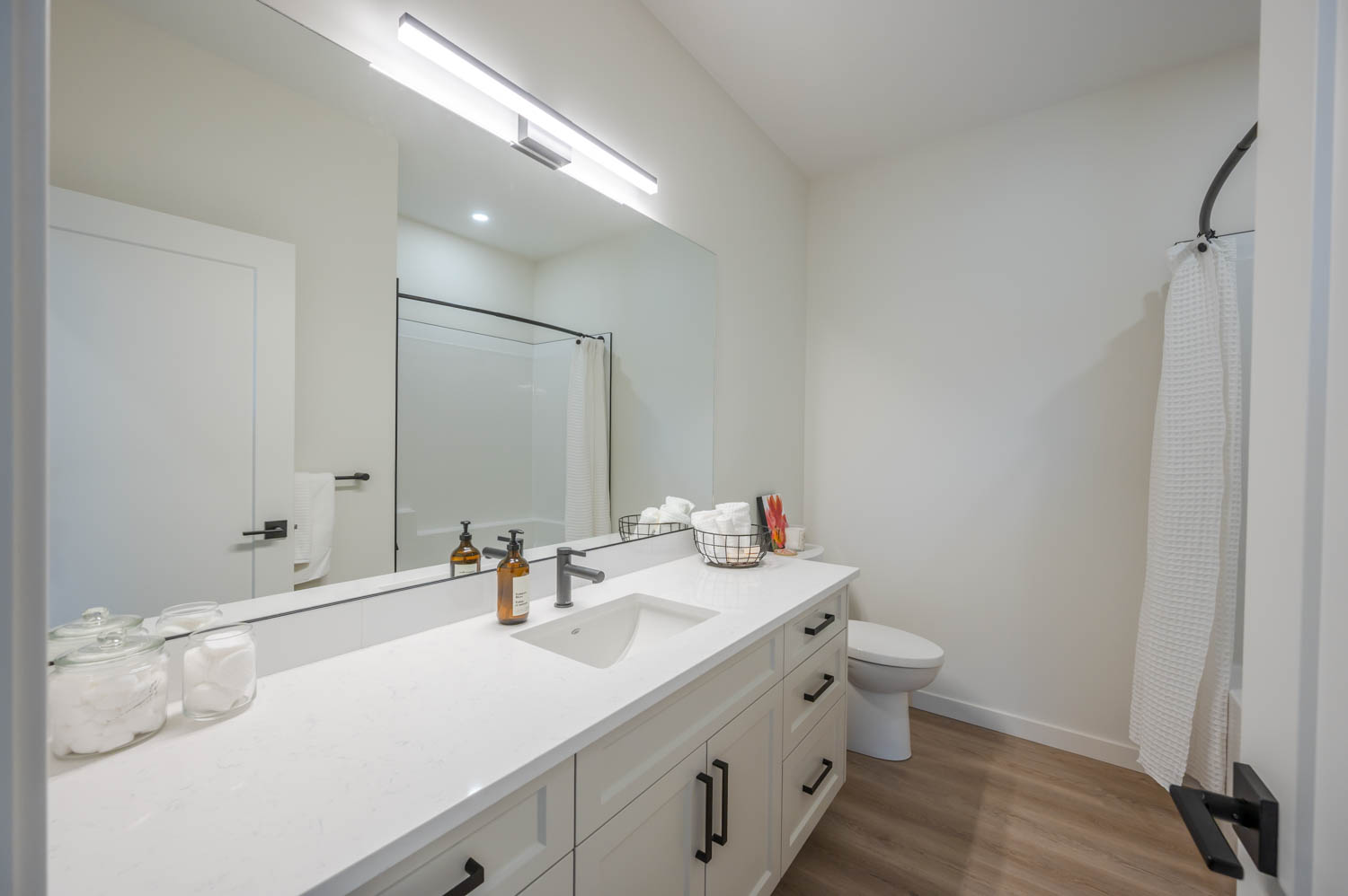 Bathroom interior with sink, toilet, and mirror