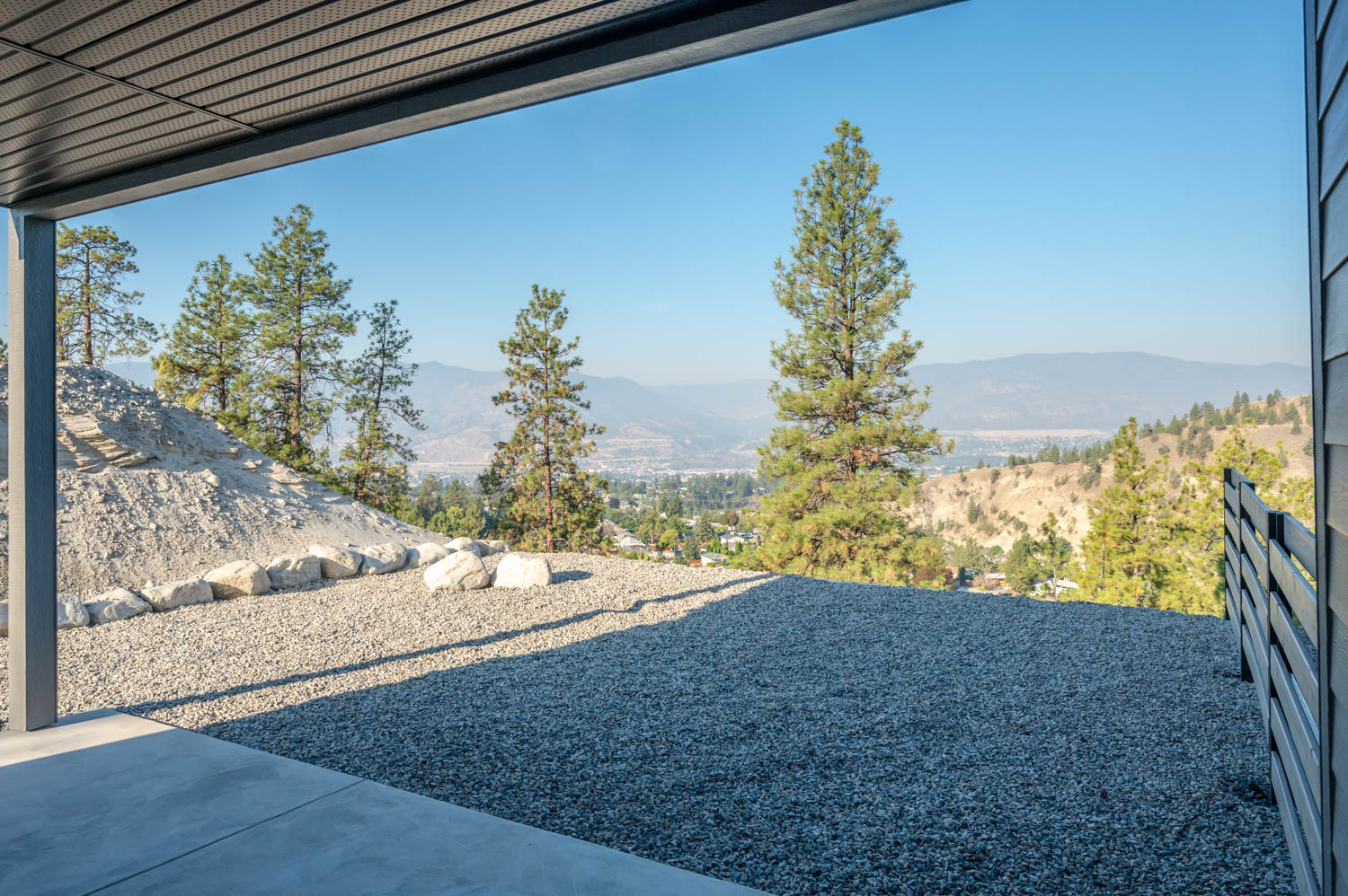 A mountain view patio overlooking a city, perfect for relaxing and enjoying the scenery.